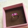 Beautiful yellow gold ring featuring three stunning rubies surrounded by sparkling cubic zirconia stones. Size M, in beautiful condition. Image 4