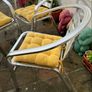 Set of matching patio chairs and four yellow seat pads Image 5