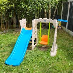 Outdoor play centre with slide and swing