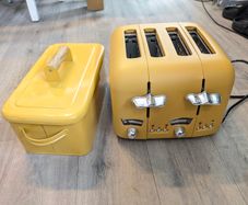 Mustard yellow 4 slice toaster and bread bin