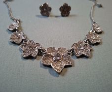 Silver tone necklace and stud earrings