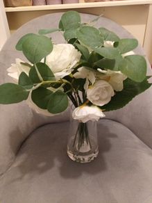 Brand new faux flowers in glass vase