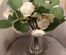 Brand new faux flowers in glass vase