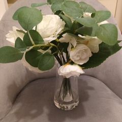 Brand new faux flowers in glass vase