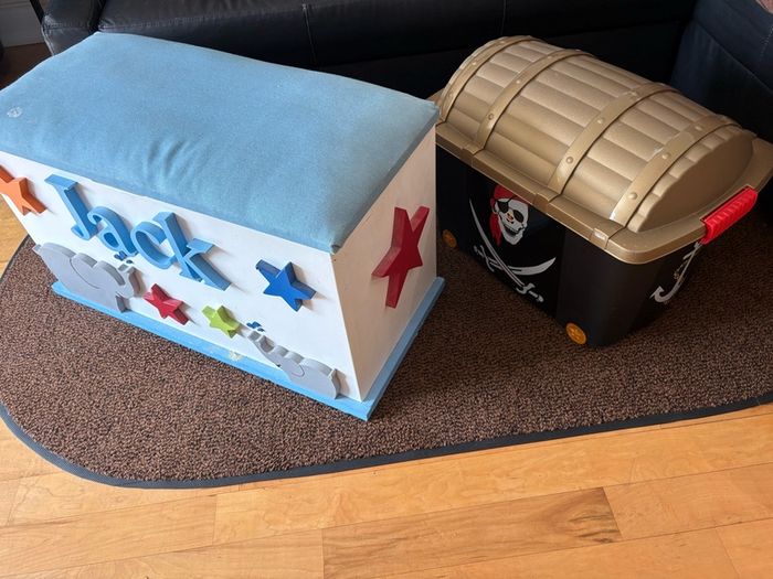 x2 Toy storage boxes Personalized white toy box features a light blue cushioned seat, the name "Jack" and pirate plastic box with lead
