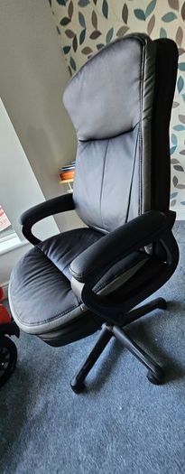High back leather executive office/ Desk Chair- adjustable height and padded arms.