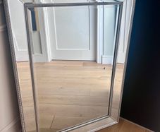 Brushed chrome ornate mirror