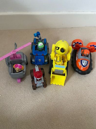 5 paw patrol cars with pups
