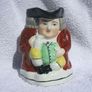 An antique TOBY JUG (Staffordshire potteries) - a seated toby holding his ale jug and cup (late 19th century). Excellent condition. About 14cm height. Image 2