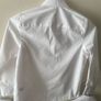 3 dunnes white shirts (new/as new) age 6-7 Image 7
