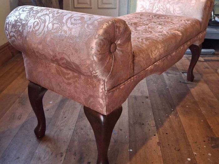 very old small type sofa