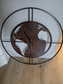 Clock in the shape of the world - needs attention