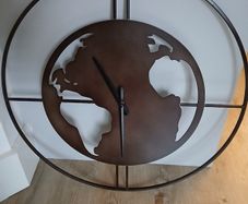 Clock in the shape of the world - needs attention