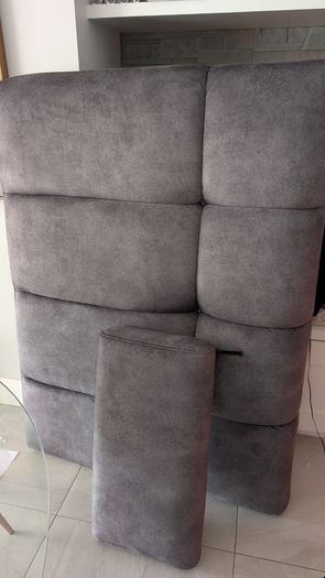 Grey upholstered seating and matching headrest