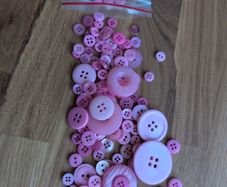 Pink plastic buttons