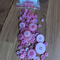 Pink plastic buttons