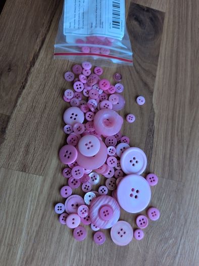 Pink plastic buttons