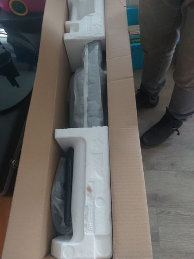 32 inch LG TV with remote and stand in box