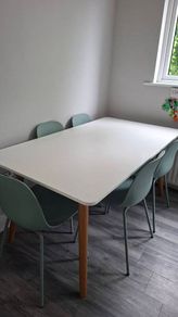 White top Rectangular Dining table from EZ Living Interiors with wooden legs