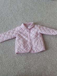 Baby girls pink quilted jacket.