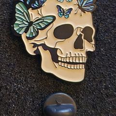 Skull/ butterfly, pin back badge.