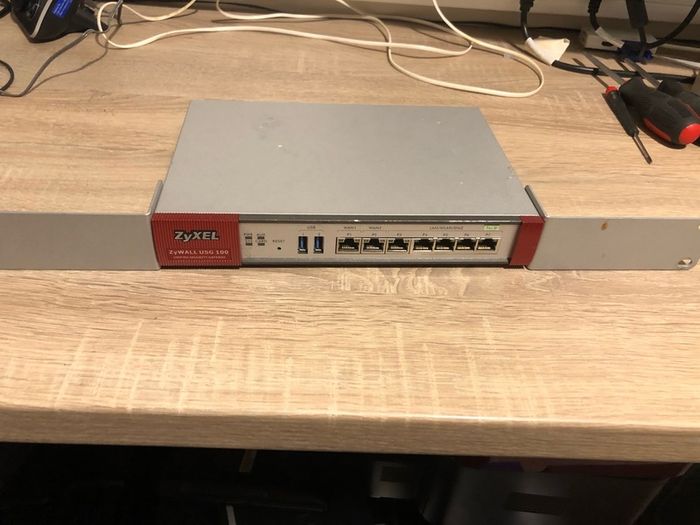 Two ZyXel USG 100 Router/ unified security gateway