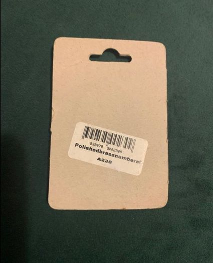 Brand new polished brass door number