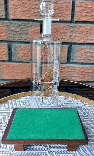 Blown Glass "Arabian Dhow" Sailing Ship Housed in Clear Glass Bottle.