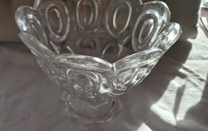 A vintage pressed glass footed bowl.