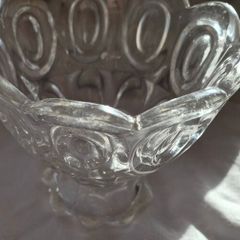 A vintage pressed glass footed bowl.