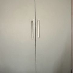 Ikea Pax wardrobe with drawers and baskets.