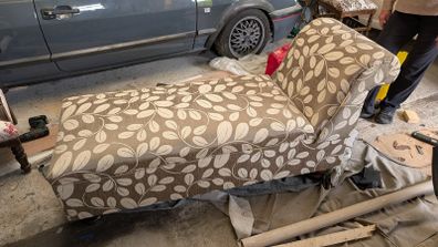 Newly upholstered Edwardian ottoman chaise lounge with plush velvet-lined interior.