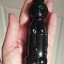 Vintage miniature "VUDU" bottle made of opaque black glass. Image 2