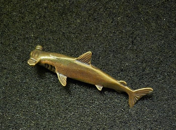 3 brass fish.