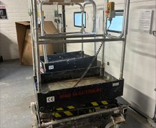 Push around scissor lift