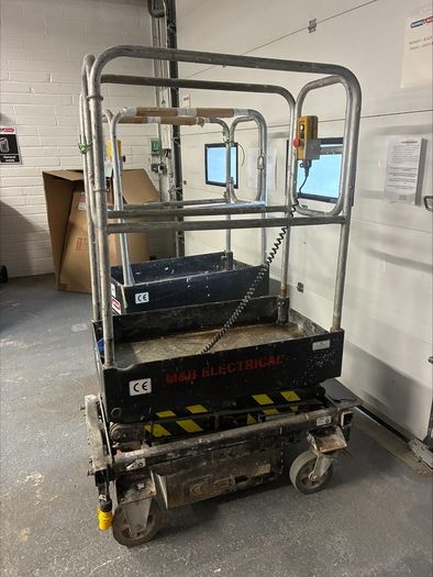 Push around scissor lift