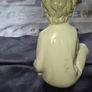Porcelain Boy with Candle Nao by Lladro, depicting a seated child in a white nightshirt holding a small candle, postage available or collection Image 3