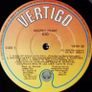 DIO Sacred heart original1985  Rare Irish translucent version. Vinyl goes golden brown when a bright light is shining through it. Has original inner lyric sheet vinyl record Image 6