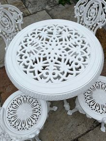 cast iron  garden table and chairs