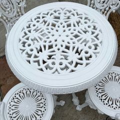 cast iron  garden table and chairs