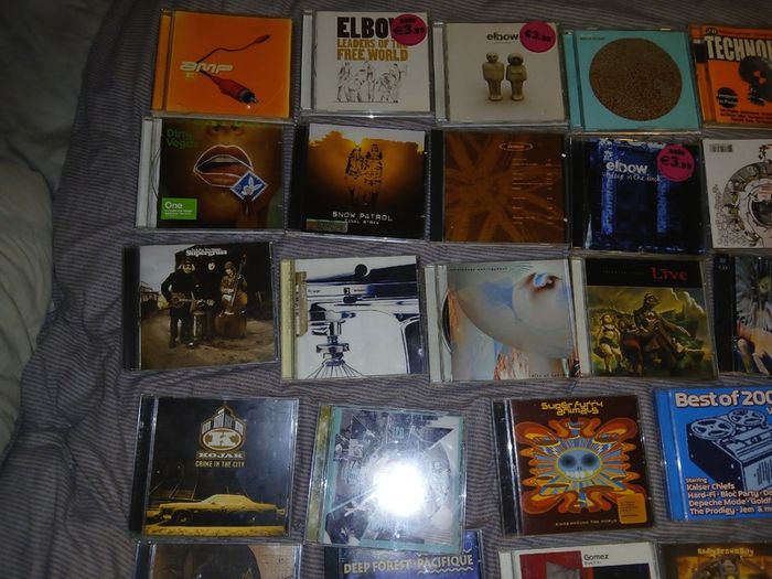 Collection of 58 assorted music CDs