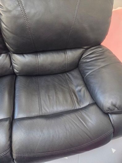 Black leather recliner sofa