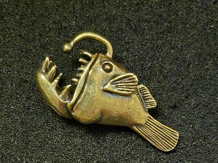 3 brass fish.