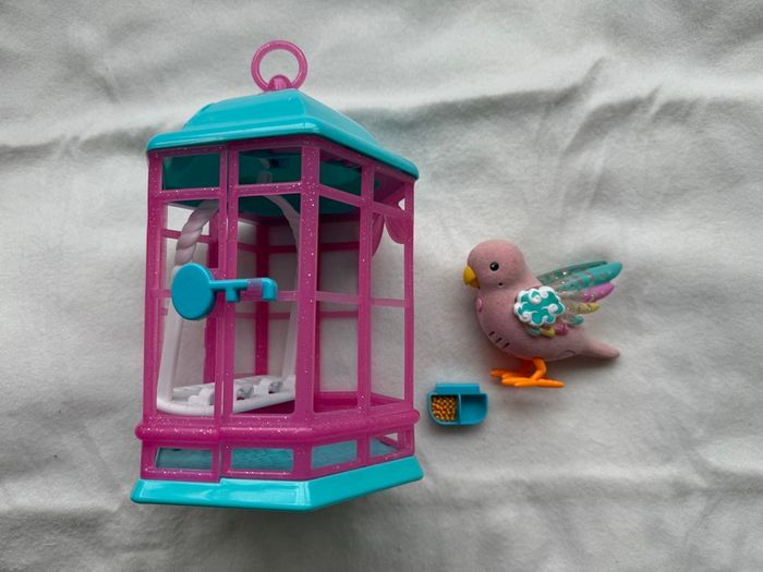 Little Live Pets Bird with Cage Rainbow Glow USed Very DIrty Please look at the pictures