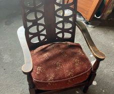 Vintage Wooden Armchair with Upholstered Seat and Decorative Back Design
