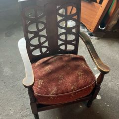 Vintage Wooden Armchair with Upholstered Seat and Decorative Back Design