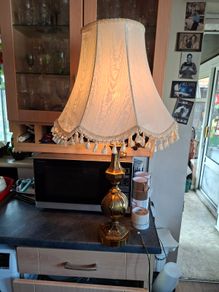 A Beautiful Large Heavy Victorian-style Brass Table Lamp with Brass Baluster Stem and Faceted, Paneled Knop, raised on a Stepped Hexagonal Base; fitted with a tall, cream textile shade with scalloped fringe and tassel trim, Postage Available or collection