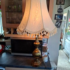 A Beautiful Large Heavy Victorian-style Brass Table Lamp with Brass Baluster Stem and Faceted, Paneled Knop, raised on a Stepped Hexagonal Base; fitted with a tall, cream textile shade with scalloped fringe and tassel trim, Postage Available or collection