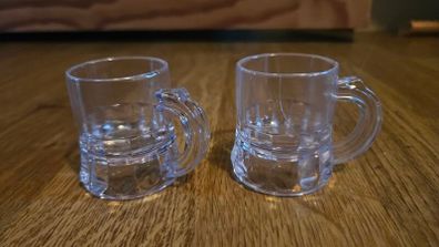 Two plastic shot glasses