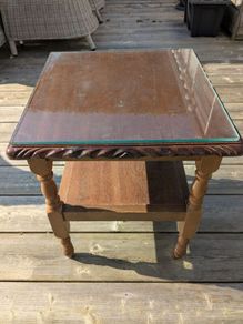 Glass topped coffee table .